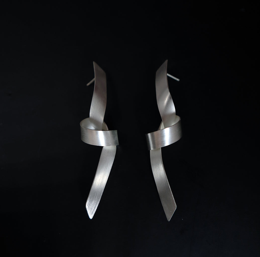 knot earrings, contemporary jewelry, long silver earrings, elegant earrings, modern jewellery, sleek earrings