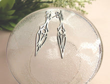 Load image into Gallery viewer, Art Deco stud earrings on a glass plate. Symmetrical and geometric modern design.
