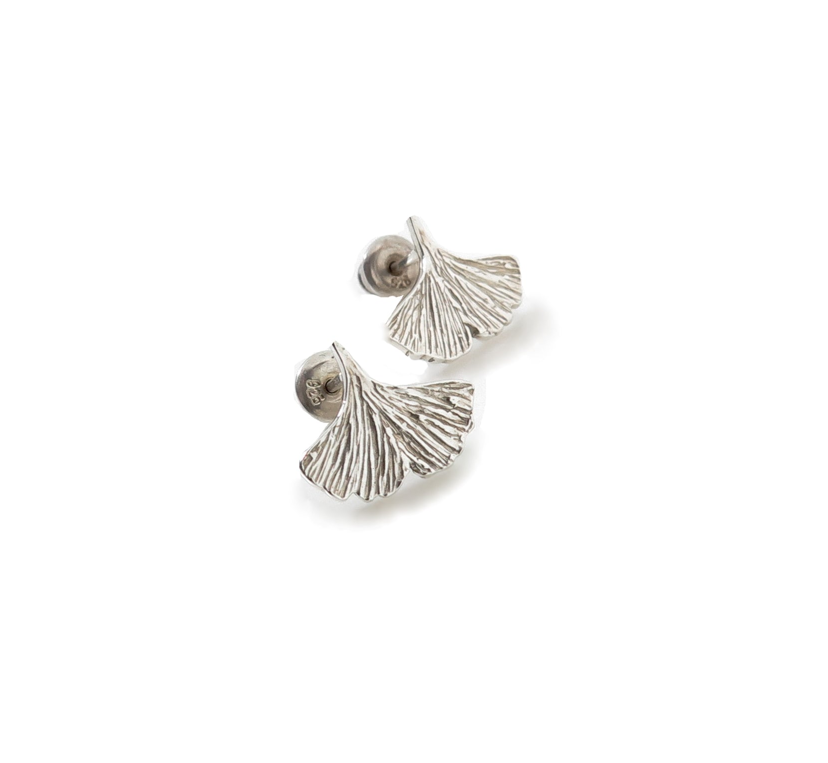 Sterling silver ginkgo leaf shaped earrings on a white background